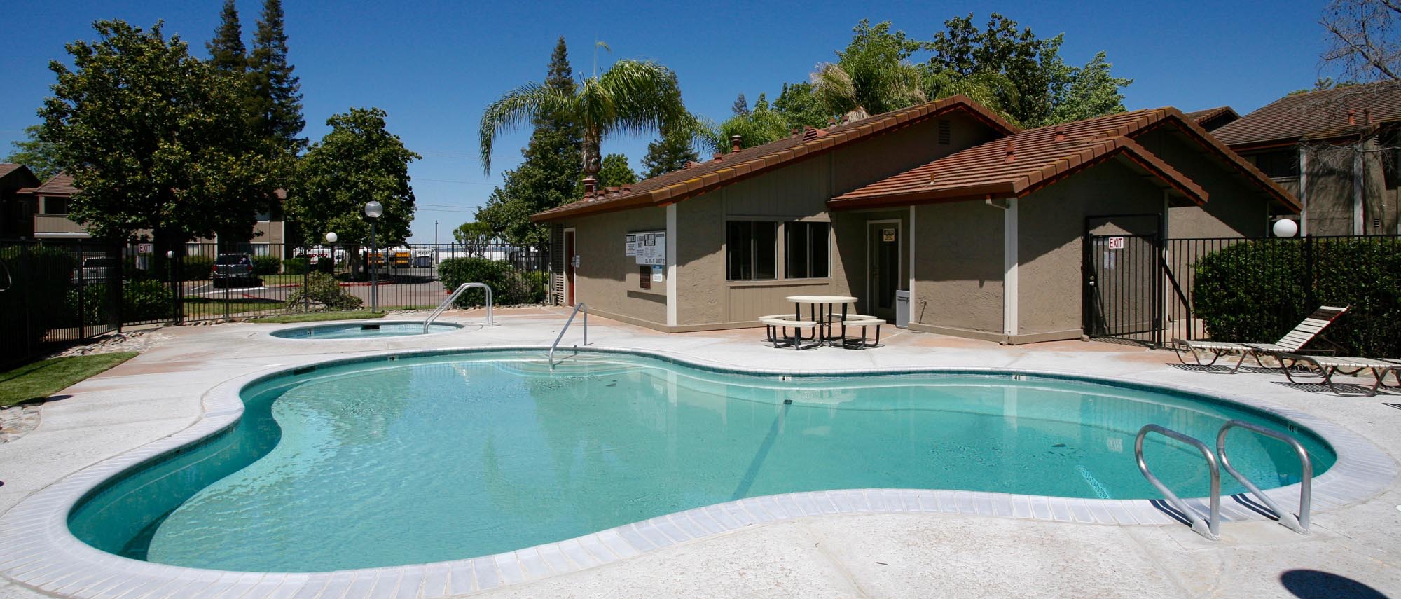 This image shows the swimming pool of the Sunflorin Village Apartments